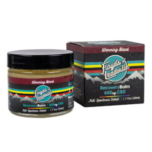 A container of Floyds of Leadville Recovery Balm Warming Blend with 600mg of Full-Spectrum Select CBD and a box of Floyds of Leadville Recovery Balm Warming Blend with 600mg of Full-Spectrum Select CBD