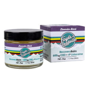 A container of Floyds of Leadville Recovery Balm Lavender Blend with 600mg of THC-Free Isolate CBD with Lidocaine and a box of Floyds of Leadville Recovery Balm Lavender Blend with 600mg of THC-Free Isolate CBD with Lidocaine